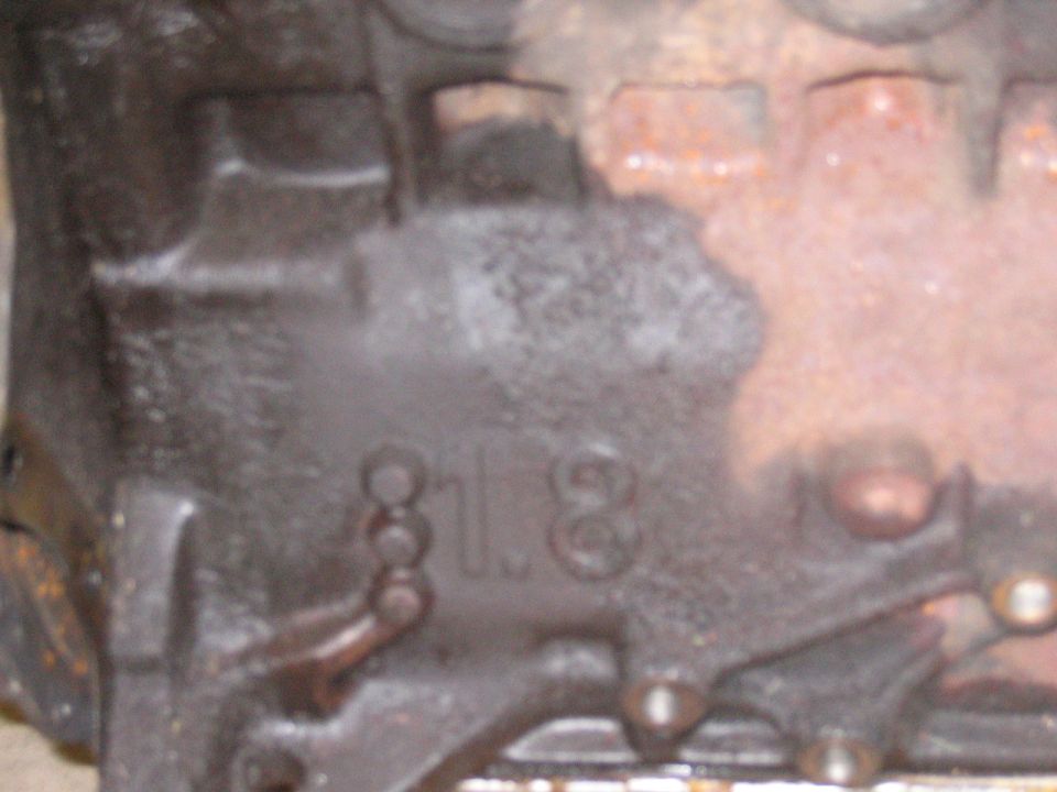 Engine block casting showing "1.8" designation