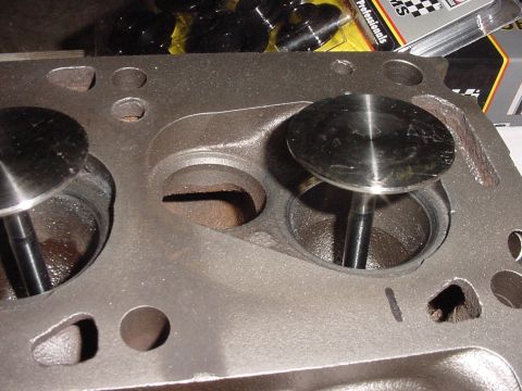1978 Ford F-250 - Close-up of an engine cylinder head with visible valves and ports, indicating internal engine components.