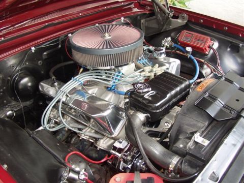 1964 Ford Galaxie - Close-up view of a car's engine bay, polished components and an aftermarket air intake system.