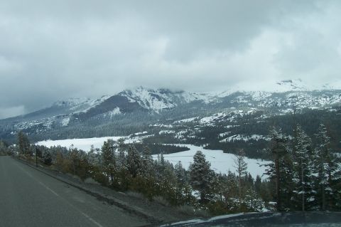 1994 Ford F-150 - Winter scene with snow-covered mountains and a frozen lake, viewed from a roadside.