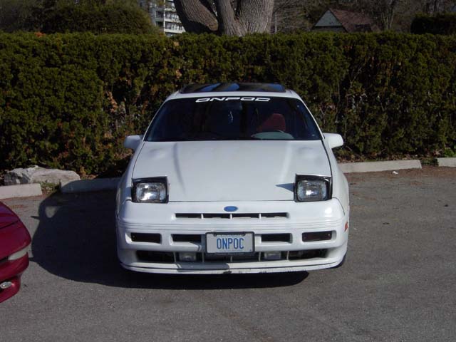 White Ford Probe front view, pop-up headlights, license plate ONPOC