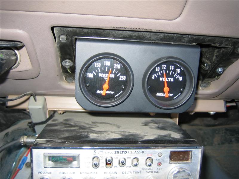 Aftermarket water and volts gauges mounted above a Cobra 29 LTD Classic CB radio