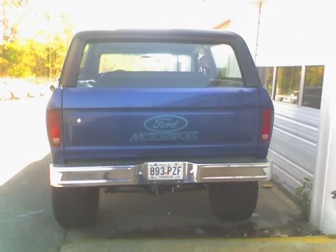 1979 Ford F-150 - This blue Ford Bronco features a 'Ford Motorsport' decal on the tailgate and a license plate from 1979.