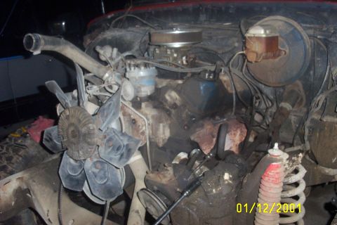 1979 Ford F-150 - Engine bay of a 1979 Ford F-150, showing the V8 engine and other mechanical parts. The image is dated 01/12/2001.