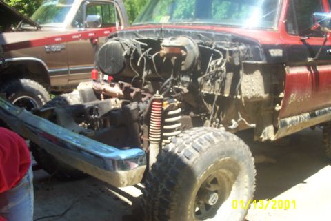 1979 Ford F-150 - Front end of a 1979 Ford F-150 is disassembled, revealing the engine bay and suspension system.