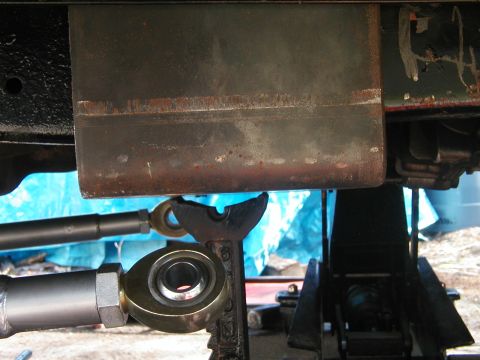 1994 Ford Bronco - The underside of a vehicle is shown, with focus on suspension components and frame structure.