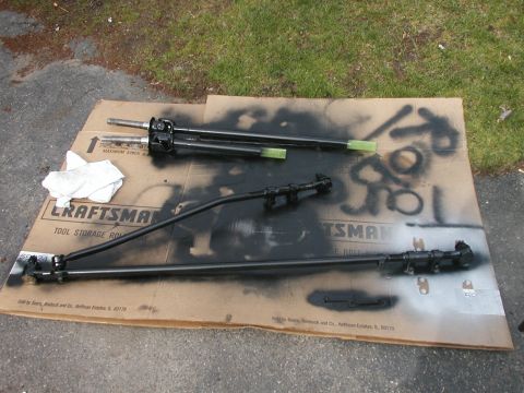 1994 Ford Bronco - Steering linkage parts are laid out on a Craftsman tool storage box, likely for painting or repair.