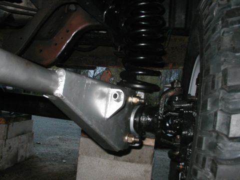 1994 Ford Bronco - Custom suspension modification shown with a large coil spring and tire.