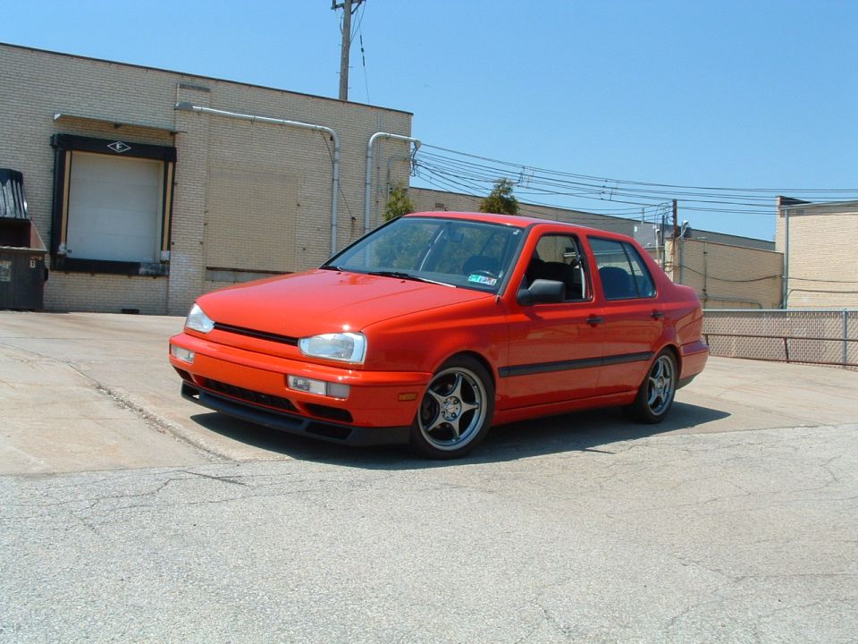 Red 1994 Volkswagen Jetta sedan, front 3/4 view