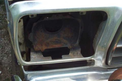1979 Ford Bronco - The front grille area of a vehicle, with visible rust on internal parts.