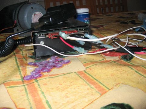 1986 Ford Bronco - An electronic device with multiple wires is visible, resting on a patterned cloth.