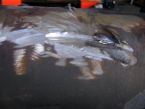 1995 Ford Bronco - This is a close-up of a metal part that has been welded and painted.