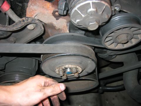 1989 Ford Bronco - Thread the fan bolts back in. These also hold the outer water pump pulley on.