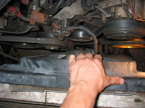 1989 Ford Bronco - Flush with the drivers side of the radiator, there is now enough clearance to mount it, and allow for some normal engine movement.