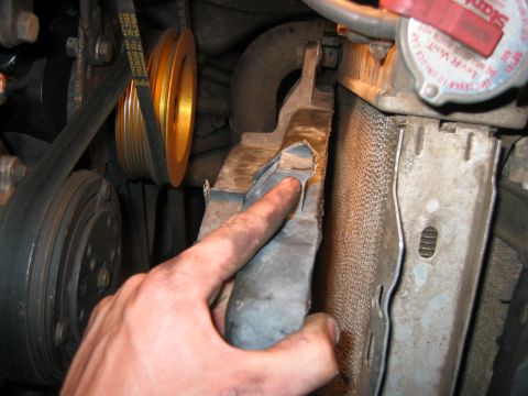 1989 Ford Bronco - Cut the mounting tab off the side of it. The tab was pushing the fan off the radiator a bit allowing for a gap, and thus the fan was closer…