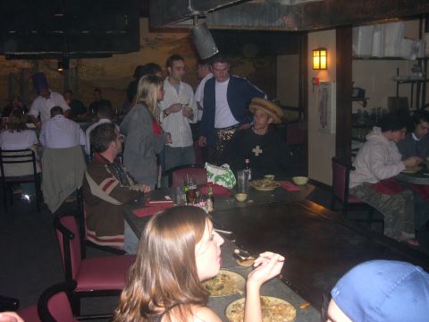 1997 Ford Probe - Diners enjoy a meal at a teppanyaki restaurant with a chef visible in the background.
