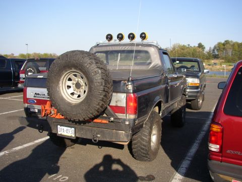 1995 Ford Bronco - This 1995 Ford Bronco is equipped with a spare tire mounted on the rear and a light bar on the roof.