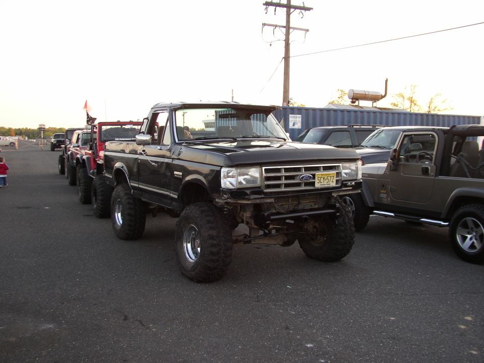 Black 1995 Ford Bronco with lifted suspension and large tires