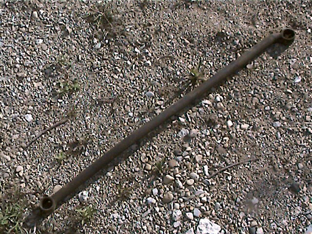 Metal rod with threaded ends, possibly a tie rod or suspension component