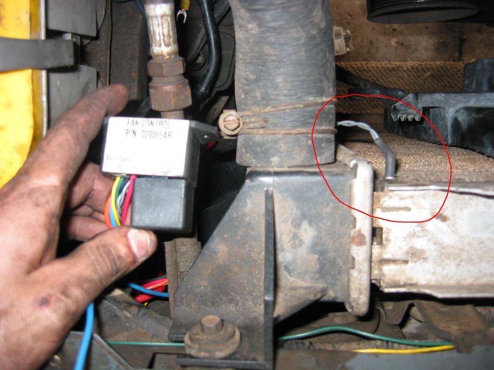 Temperature probe installed right next to the inlet coolant hose. Its a nice tight fit, I cant imagine it will wiggle loose over time, but if it does I'll just move it. I might even move it closer to the middle of the radiator so there is a lag time and it doesnt come on just because of a temperature spike from a high engine load.