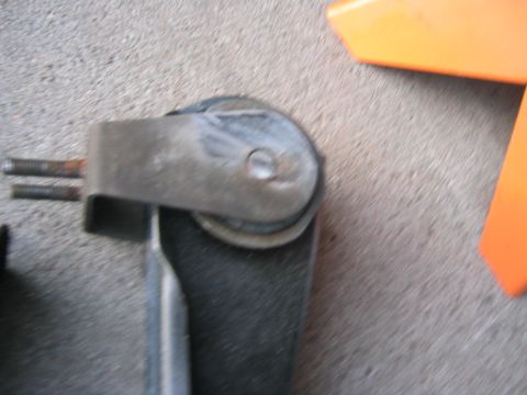 1997 Jeep Cherokee - A close-up view of a vehicle's suspension component, possibly a shock absorber mount or linkage.