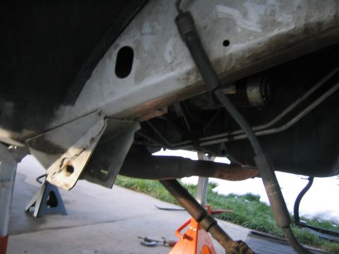 1997 Jeep Cherokee - The underside of a vehicle is shown, with various mechanical components and supports.