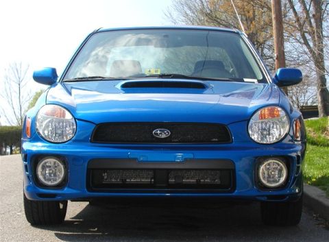 2002 Subaru Impreza - Front view of a blue 2002 Subaru Impreza WRX, showing its distinctive grille and headlights.