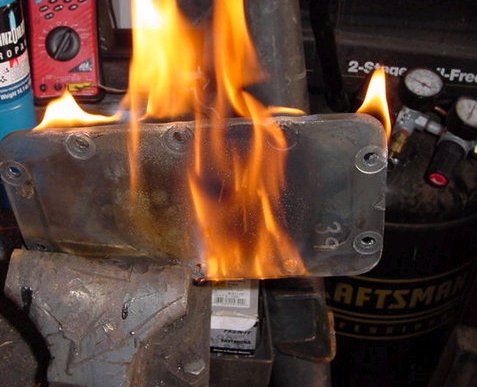 1971 Ford Bronco - A metal component is engulfed in flames, possibly during a repair or fabrication process.