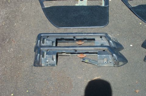 1991 Ford Crown Victoria LTD - Interior door panels and dashboard trim pieces are shown laid out on asphalt.