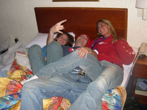 1997 Ford Probe - A group of friends relax together on a hotel room bed.