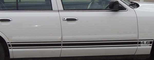 White sedan side view with black racing stripes and "4.6 INTERCEPTOR" decal