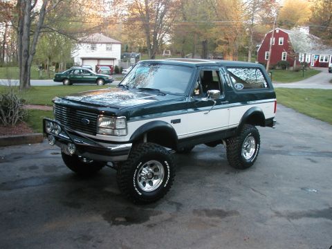 1994 Ford Bronco - This lifted Ford Bronco features a two-tone paint scheme and aggressive off-road tires.