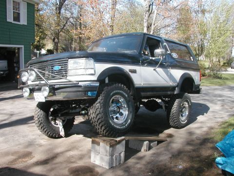 1994 Ford Bronco - This lifted Ford Bronco has a two-tone paint scheme and custom front bumper.