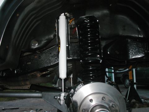 1994 Ford Bronco - Vehicle suspension components including a shock absorber and coil spring are visible.