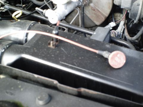 1987 Ford Bronco - A close-up view of the engine bay shows various wires and components.