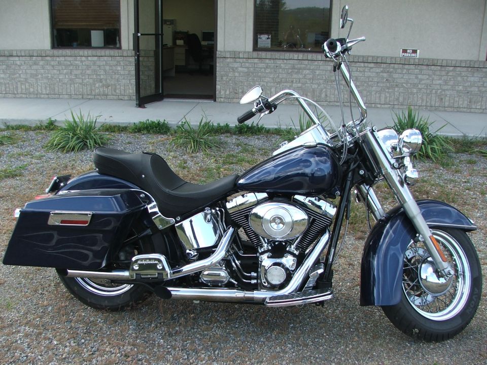 Dark blue motorcycle with flame decals, 3q-front view