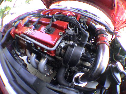 1997 Ford Probe - Close-up view of a car's engine bay, showing various components and wiring.