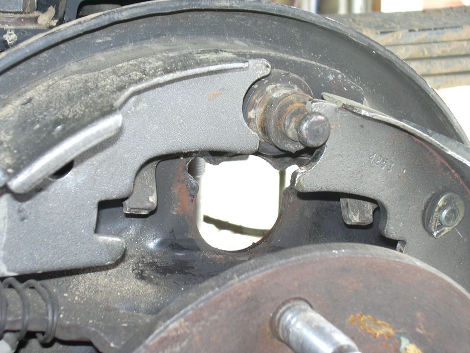 Brake drum assembly with brake shoes and hardware. Part number 4253 is visible