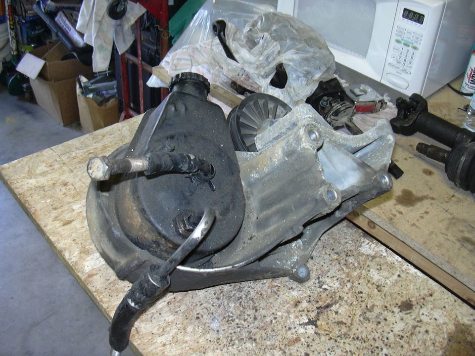 Power steering pump with pulley and mounting bracket