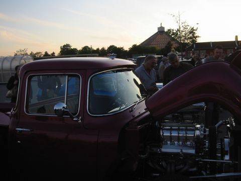 1992 Ford Crown Victoria - Customized pickup truck with a polished engine on display at an outdoor event.