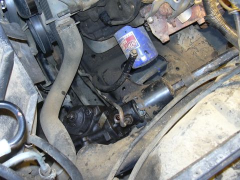 1991 Ford Bronco - Close-up view of engine components including the steering gear box and oil filter.