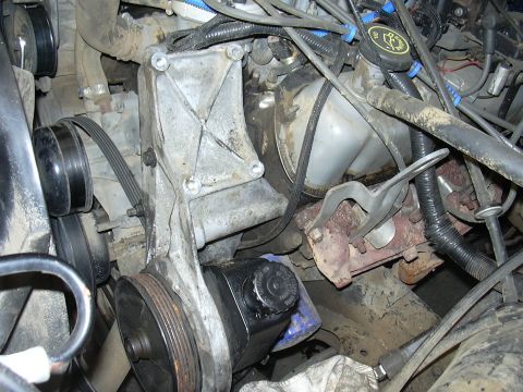 1991 Ford Bronco - Close-up view of the engine bay in a 1991 Ford Bronco, highlighting the power steering pump and associated components.
