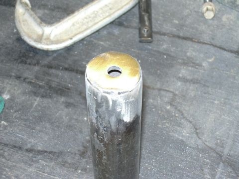 1991 Ford Bronco - Close-up of a metal part with a hole, possibly a custom component or repair part.