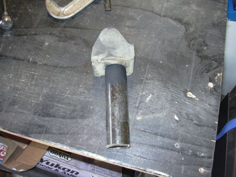 1991 Ford Bronco - A close-up view of a vehicle suspension component, possibly a bump stop, on a workbench.