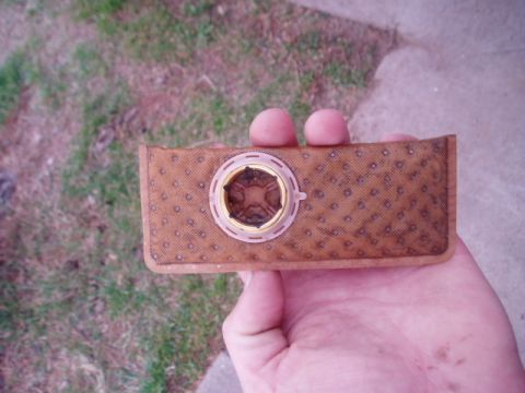 1990 Ford Bronco - A fuel filter, likely for a vehicle, is held up for inspection. The registry claims it is from a 1990 Ford Bronco, but this cannot be confi…