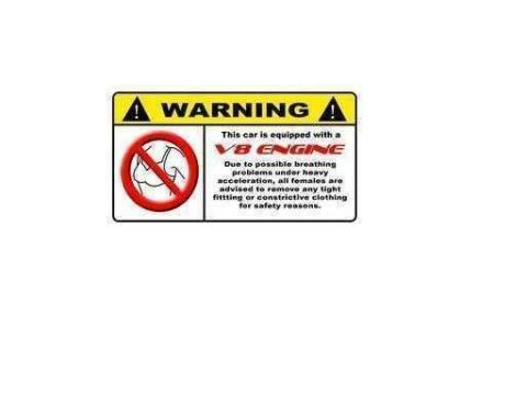 1986 Ford Bronco - This is a warning sticker related to a V8 engine and clothing choices.