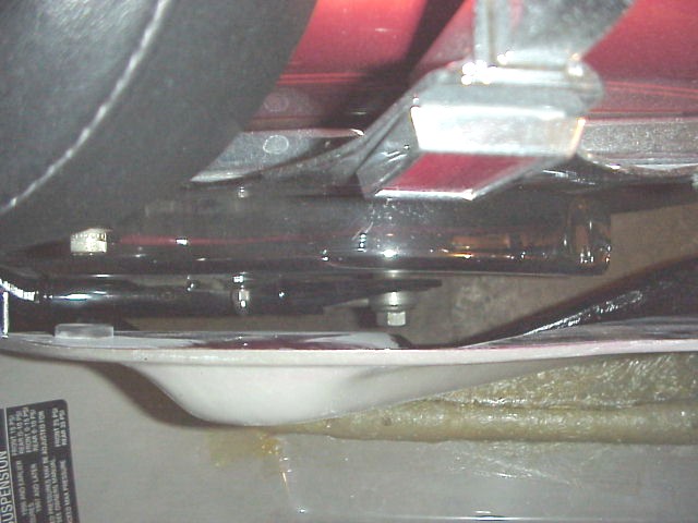 pay very close attention to the clearance for the softail swing arm.  it would be a real drag to do all this work and then have a pothole send that bolt up and into that fiberglass bag.