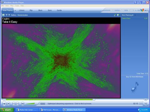 1988 Ford Bronco - The screen shows the Windows Media Player interface with a song by the Eagles playing and a vibrant abstract visualizer.