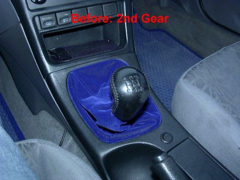 1995 Ford Probe - Manual gear shifter with blue velvet boot and visible gear pattern. Text indicates 'Before: 2nd Gear'.