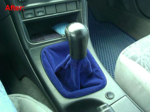 1995 Ford Probe - Aftermarket blue velvet shifter boot installed in a vehicle interior, alongside a textured floor mat.